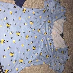 a blue top for women with yellow flowers